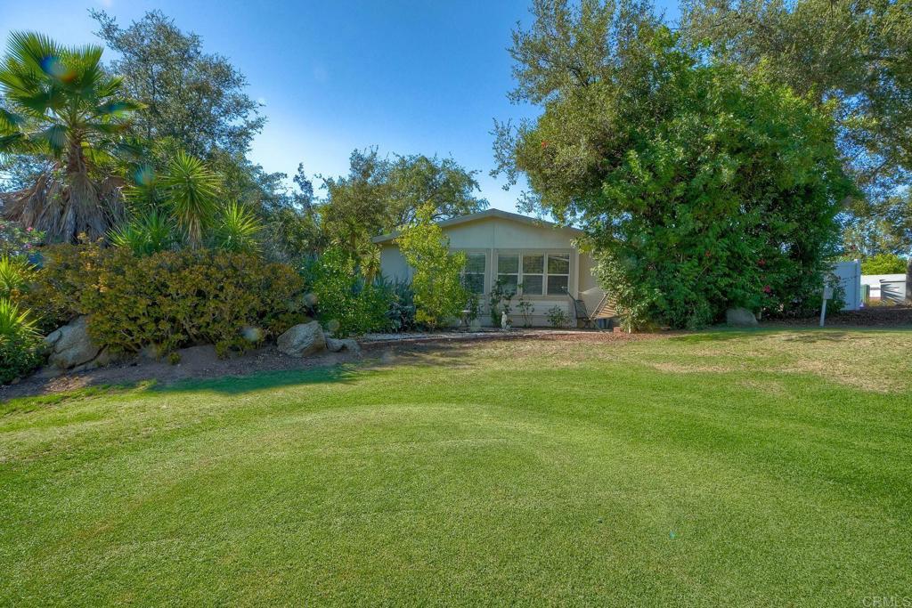 18218 Paradise Mountain Road Valley Center, CA 92082 - Photo 34 of 36 a front view of a house with garden