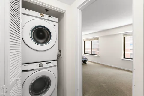 a view of a hallway with washer and dryer
