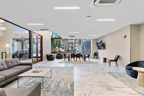 a living room with furniture and white walls