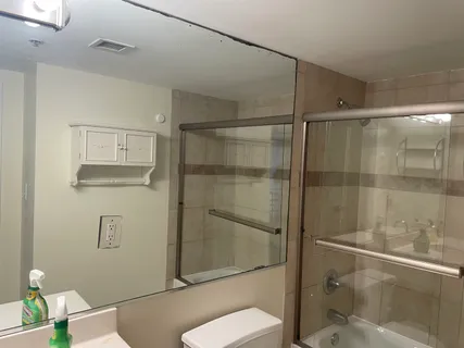 a bathroom with a shower and toilet
