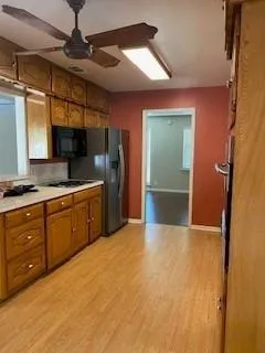 a kitchen with a refrigerator and a sink