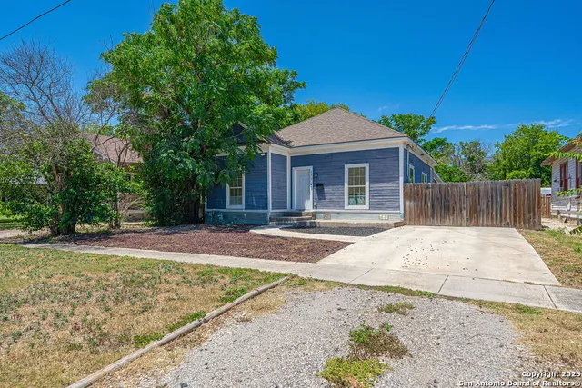 a house with trees in front of it