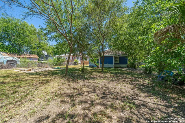 a backyard of a house with lots of green space