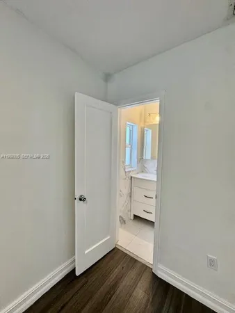 a bathroom with a sink toilet a mirror and shower