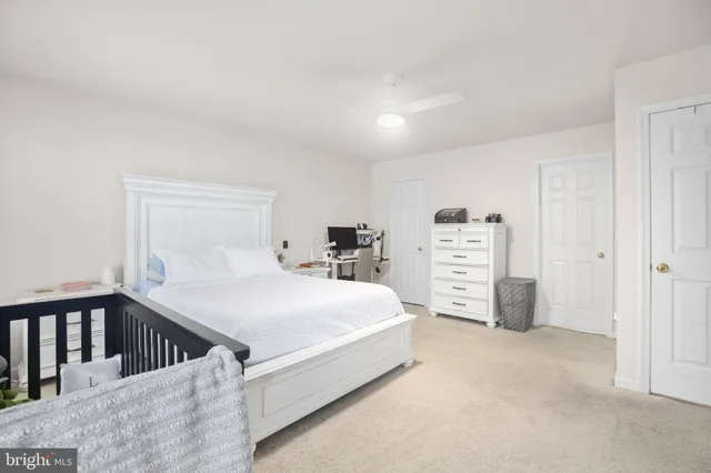 a bedroom with a bed and dresser