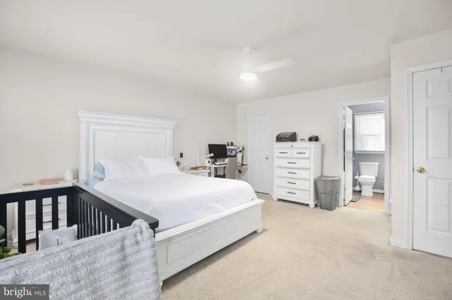 a bedroom with a bed and dresser