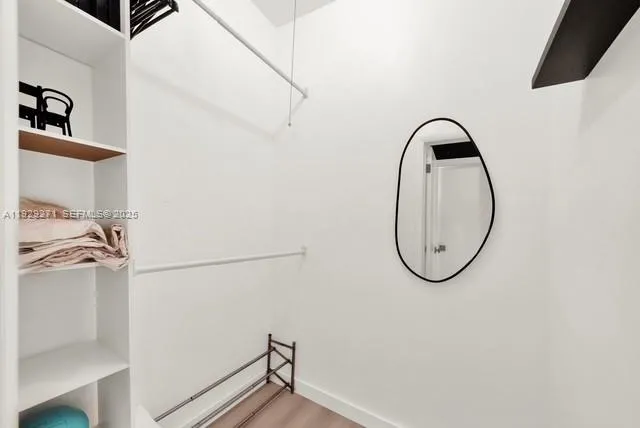 a kitchen with a sink and a refrigerator