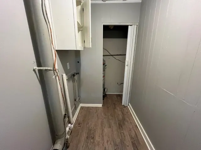a view of hallway with wooden floor