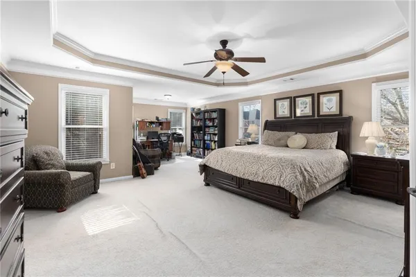 a bedroom with furniture and a window