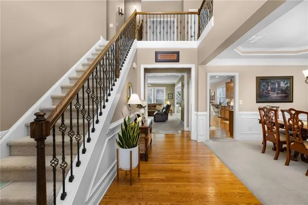 a view of entryway livingroom and hall with wooden floor