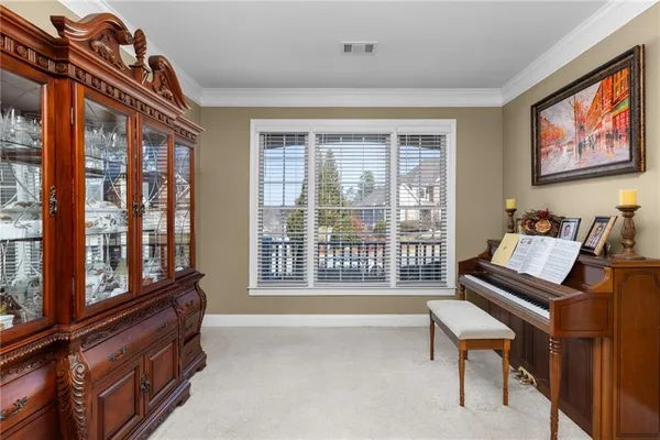 a kitchen with stainless steel appliances granite countertop a refrigerator oven a sink dishwasher and white cabinets with wooden floor