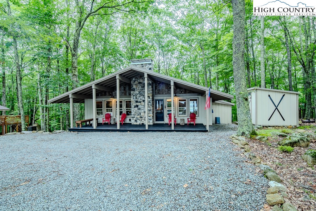 821 Pine Ridge Road Beech Mountain, NC 28604 - Photo 1 of 38 a view of a house with a yard