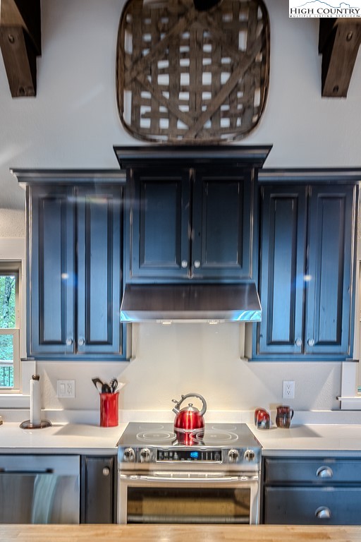 821 Pine Ridge Road Beech Mountain, NC 28604 - Photo 16 of 38 a kitchen with stainless steel appliances granite countertop a sink and cabinets