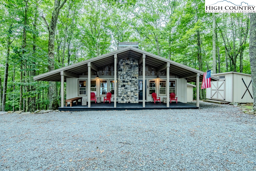 821 Pine Ridge Road Beech Mountain, NC 28604 - Photo 38 of 38 a view of a house with a backyard