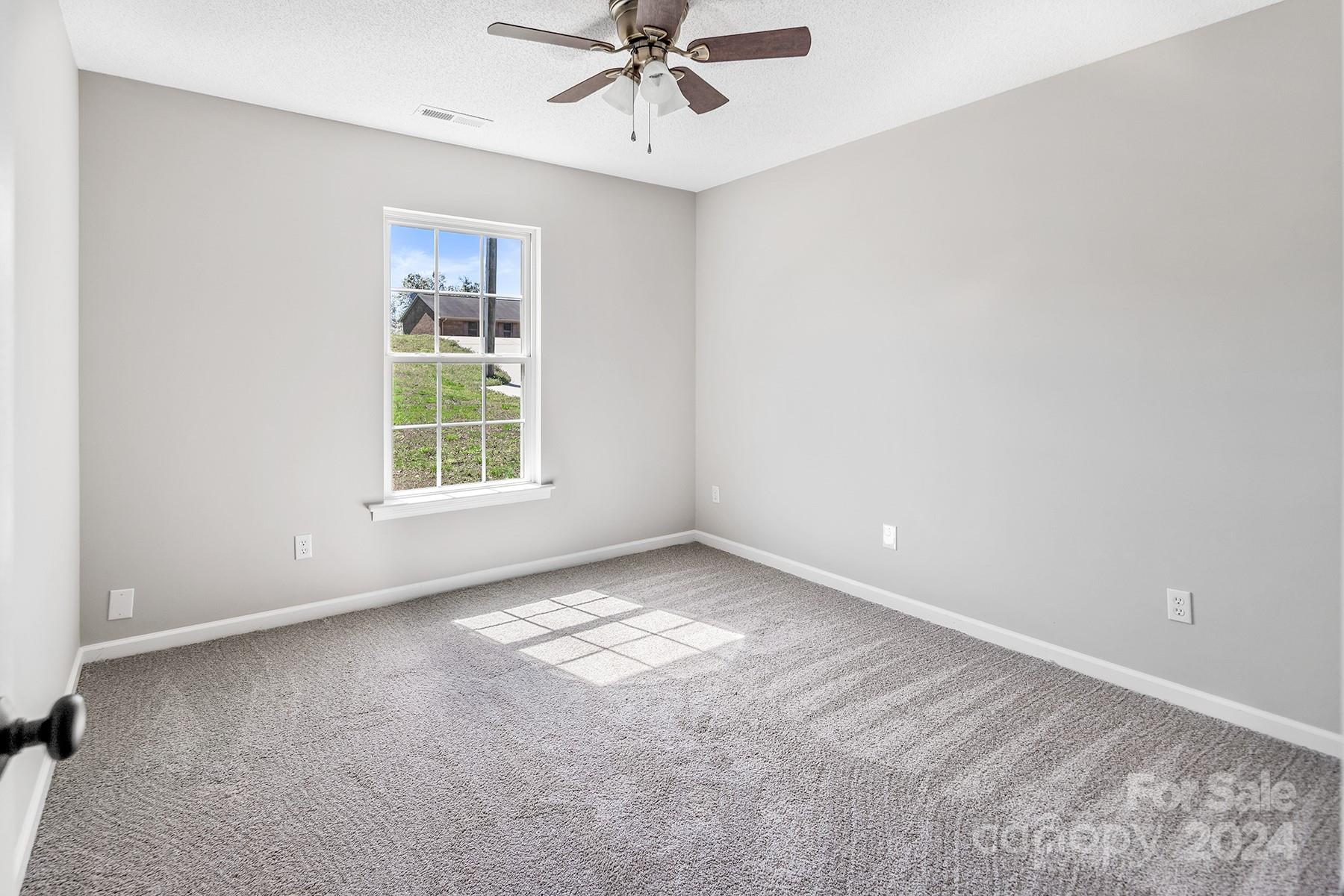 8567 Unity Church Road Denver, NC 28037 - Photo 23 of 38 an empty room with a window