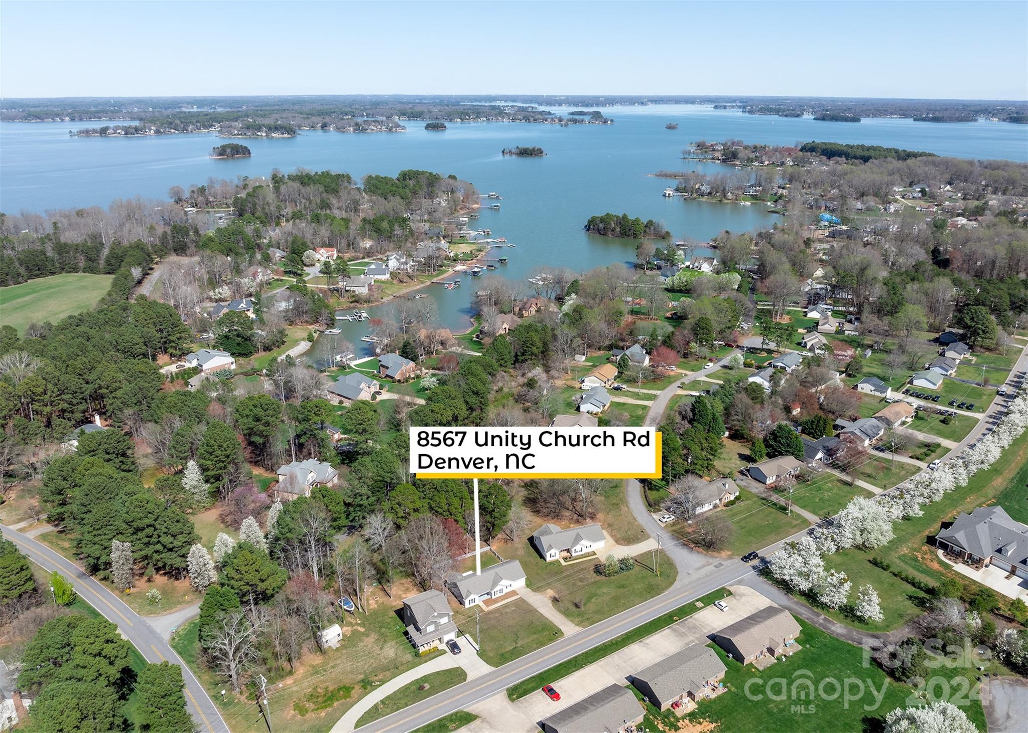 8567 Unity Church Road Denver, NC 28037 - Photo 3 of 38 an aerial view of a city with lots of residential buildings