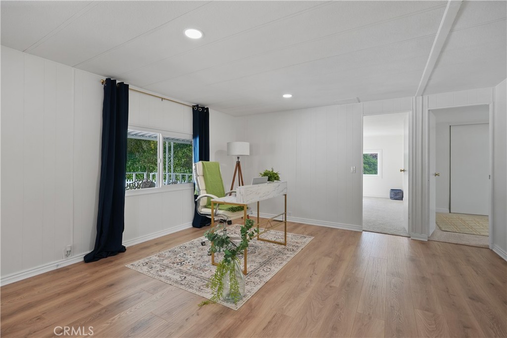 31130 South General Kearny Road, Unit 136 Temecula, CA 92591 - Photo 21 of 65 a living room with furniture and a wooden floor