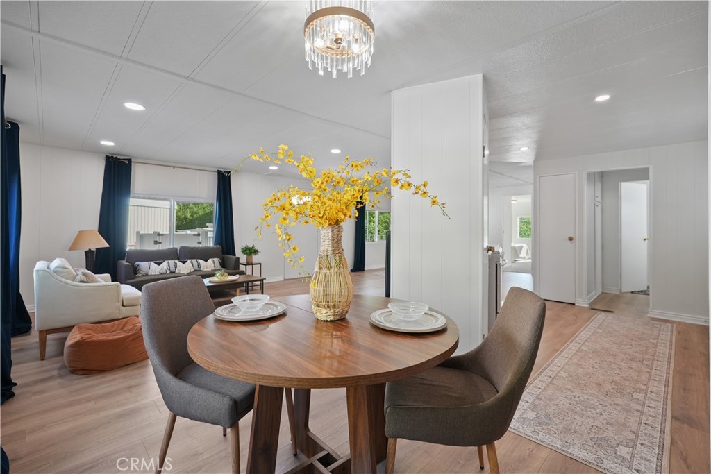 31130 South General Kearny Road, Unit 136 Temecula, CA 92591 - Photo 27 of 65 a view of a dining room with furniture and wooden floor