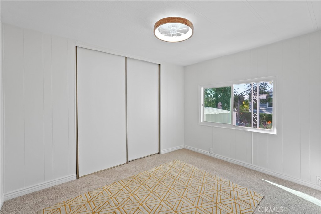 31130 South General Kearny Road, Unit 136 Temecula, CA 92591 - Photo 38 of 65 an empty room with a fan