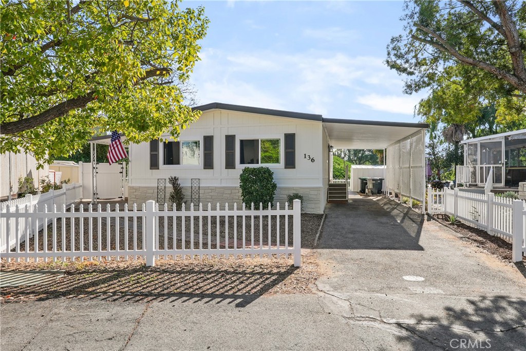 31130 South General Kearny Road, Unit 136 Temecula, CA 92591 - Photo 4 of 65 a view of a house with a yard