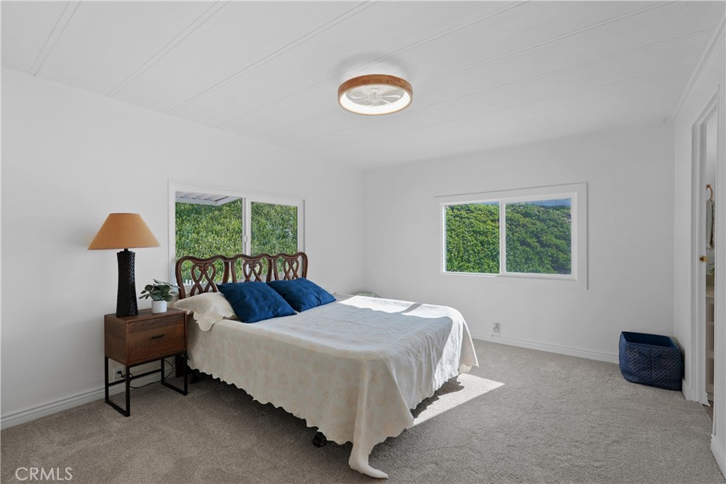 31130 South General Kearny Road, Unit 136 Temecula, CA 92591 - Photo 41 of 65 Primary bedroom with 2 bright windows