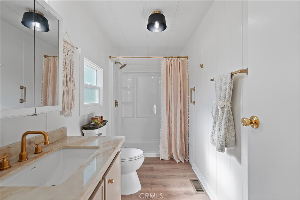 31130 South General Kearny Road, Unit 136 Temecula, CA 92591 - Photo 46 of 65 a bathroom with a sink toilet and shower