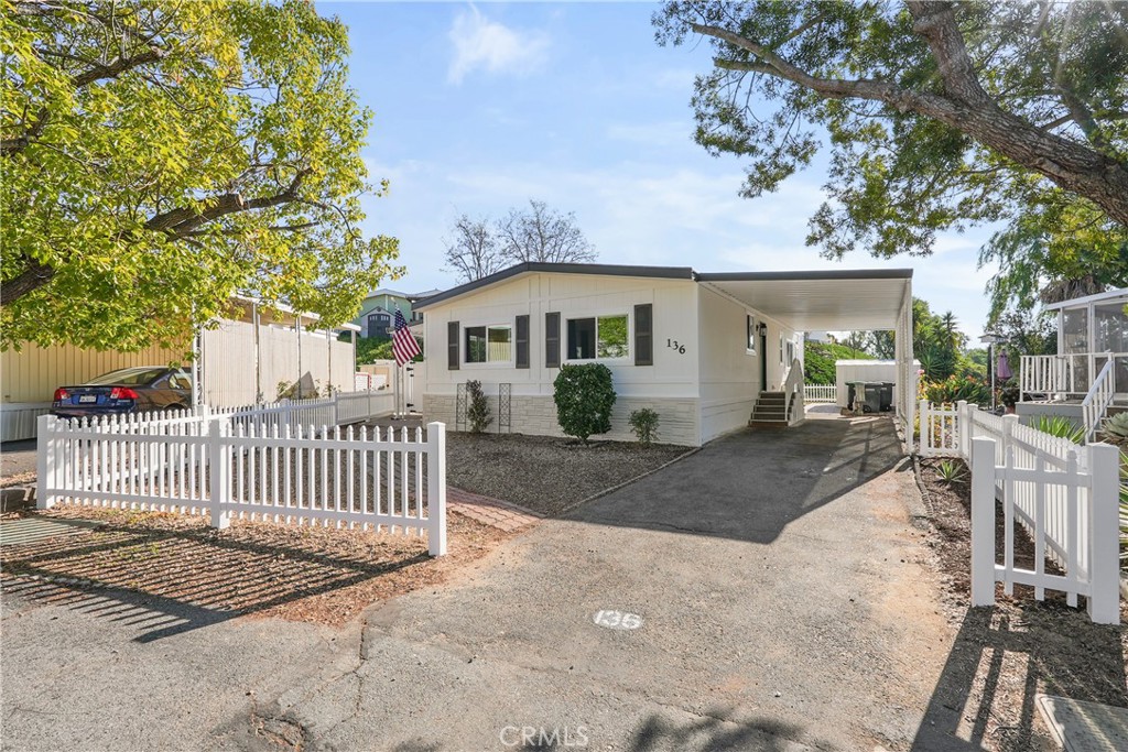 31130 South General Kearny Road, Unit 136 Temecula, CA 92591 - Photo 57 of 65 a view of a house with a patio and a yard