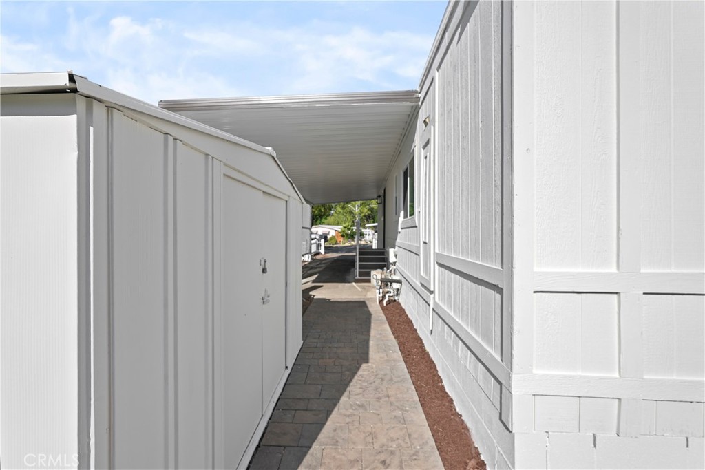 31130 South General Kearny Road, Unit 136 Temecula, CA 92591 - Photo 58 of 65 a view of a hallway with wooden floor and staircase
