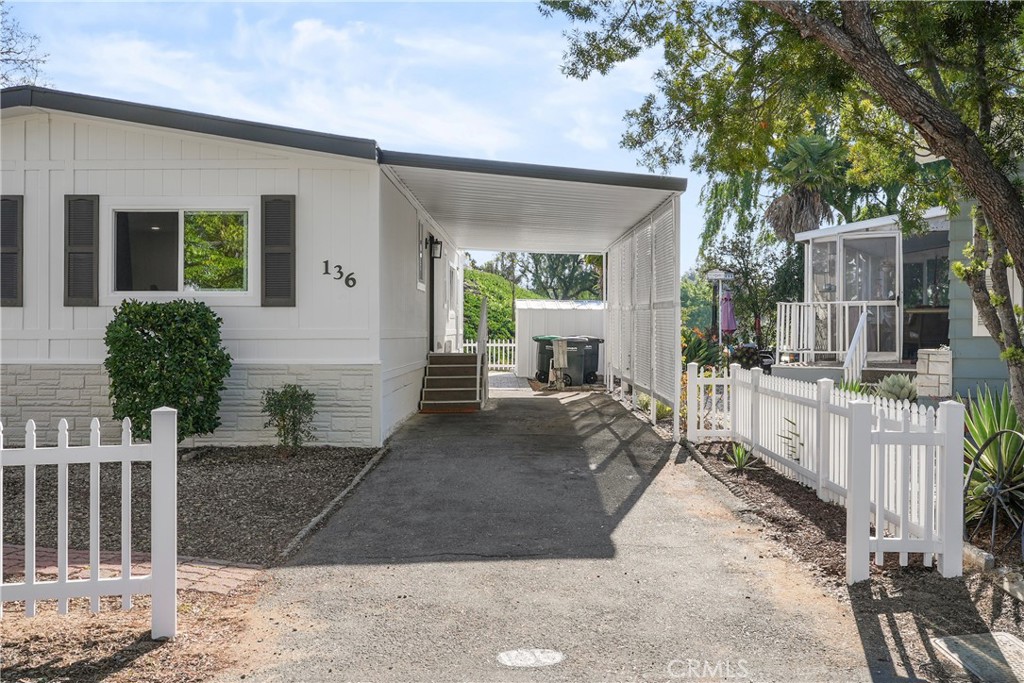 31130 South General Kearny Road, Unit 136 Temecula, CA 92591 - Photo 6 of 65 a view of a house with backyard and sitting area