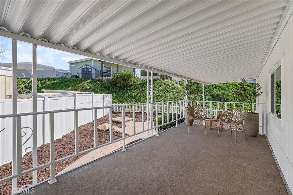 31130 South General Kearny Road, Unit 136 Temecula, CA 92591 - Photo 8 of 65 a view of a chairs and table in backyard