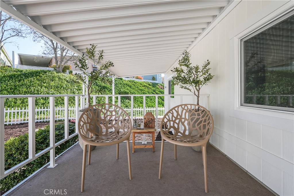 31130 South General Kearny Road, Unit 136 Temecula, CA 92591 - Photo 9 of 65 a view of a chair and table in a patio