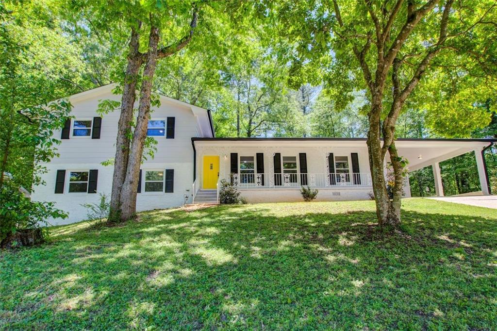 front view of a house with a yard
