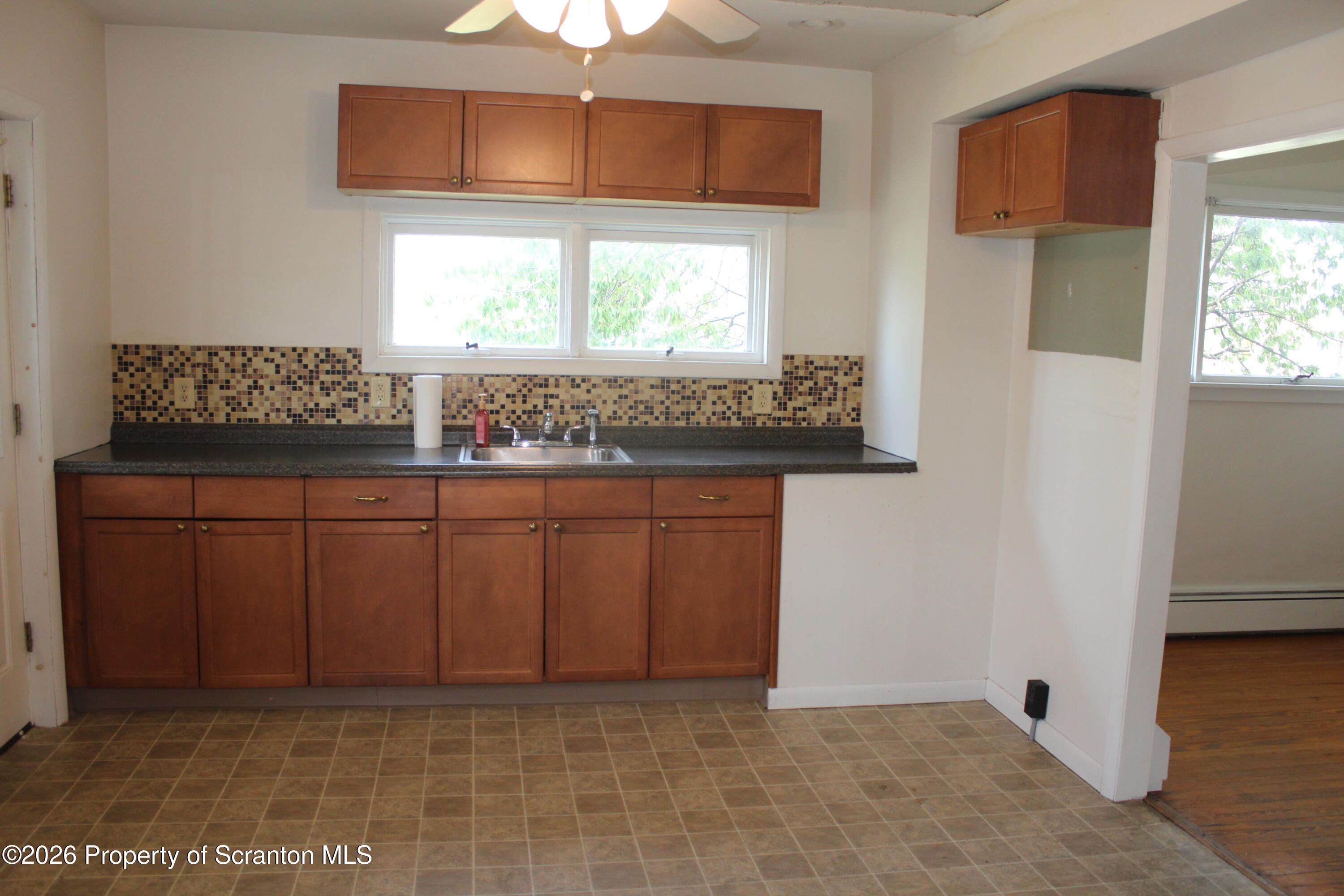 1608 Prospect Avenue Scranton, PA 18505 - Photo 5 of 30 a kitchen with a sink cabinets and a window