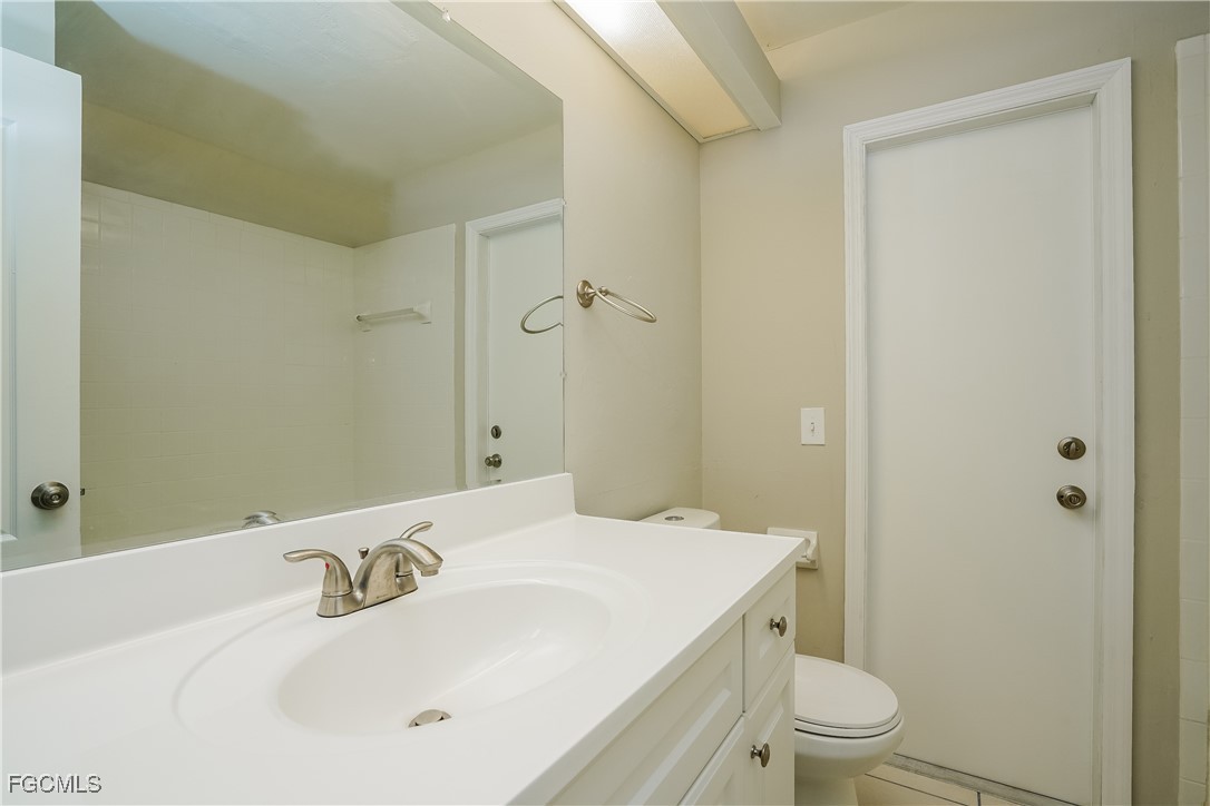 18257 Columbine Road Fort Myers, FL 33967 - Photo 13 of 16 a bathroom with a sink a toilet and shower