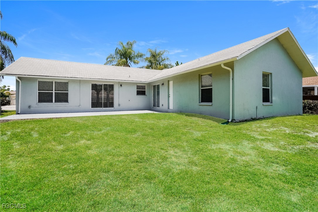 18257 Columbine Road Fort Myers, FL 33967 - Photo 15 of 16 a view of a house with a backyard