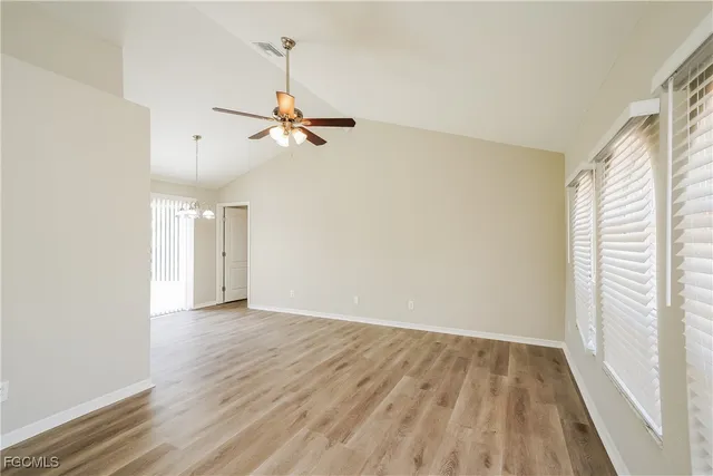 a view of room with a ceiling fan and window