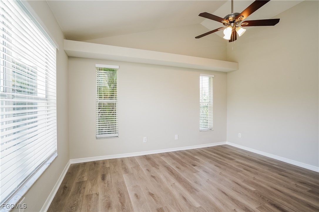 18257 Columbine Road Fort Myers, FL 33967 - Photo 8 of 16 a view of empty room with wooden floor and fan