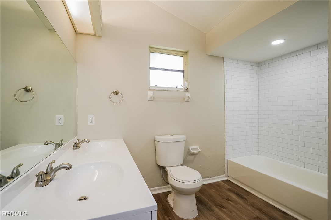 18257 Columbine Road Fort Myers, FL 33967 - Photo 10 of 16 a bathroom with a sink a toilet and shower