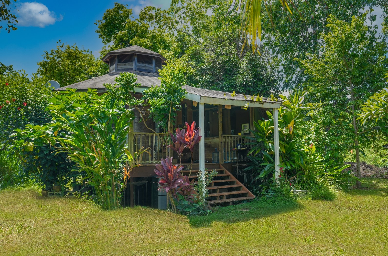 6565 C Koolau Road Kilauea, HI 96754 - Photo 10 of 30 a view of a house with backyard and garden