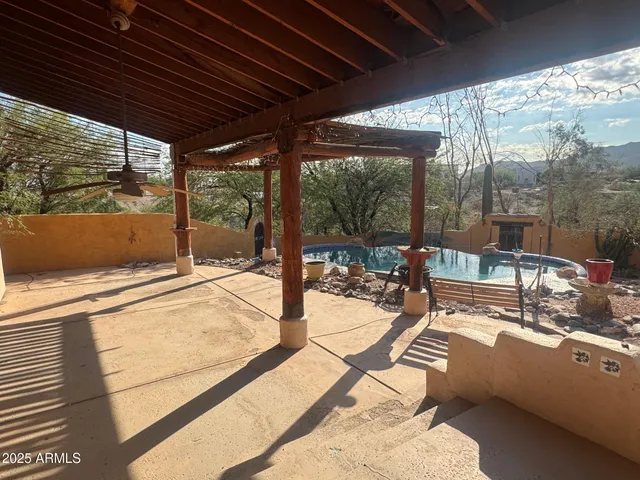 a view of swimming pool with outdoor seating