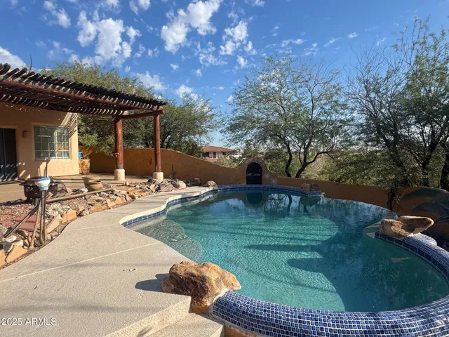 a view of a swimming pool with a patio