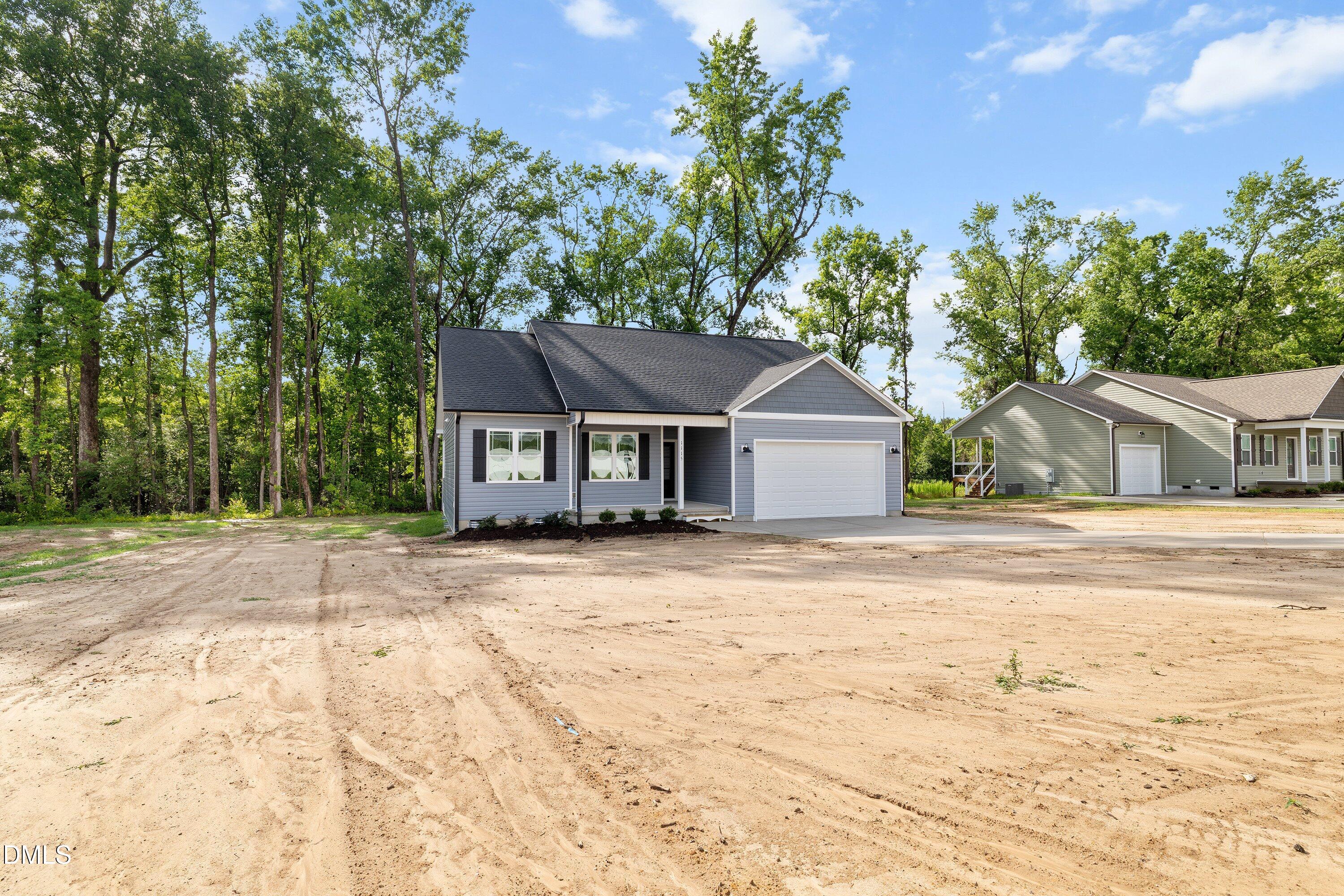 1115 Nor-Am Road Pikeville, NC 27863 - Photo 7 of 40 a front view of a house with a yard
