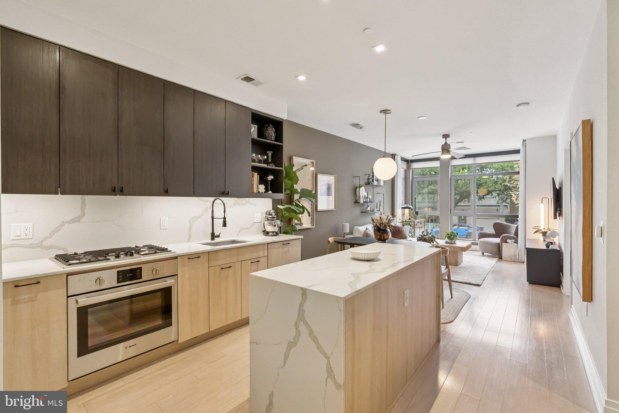 900 11th Street Southeast, Unit 106 Washington, DC 20003 - Photo 11 of 26 a large white kitchen with a large window