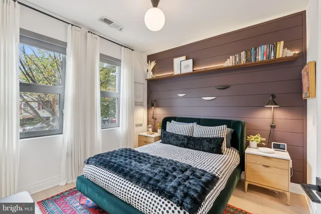 a bedroom with a bed and a window