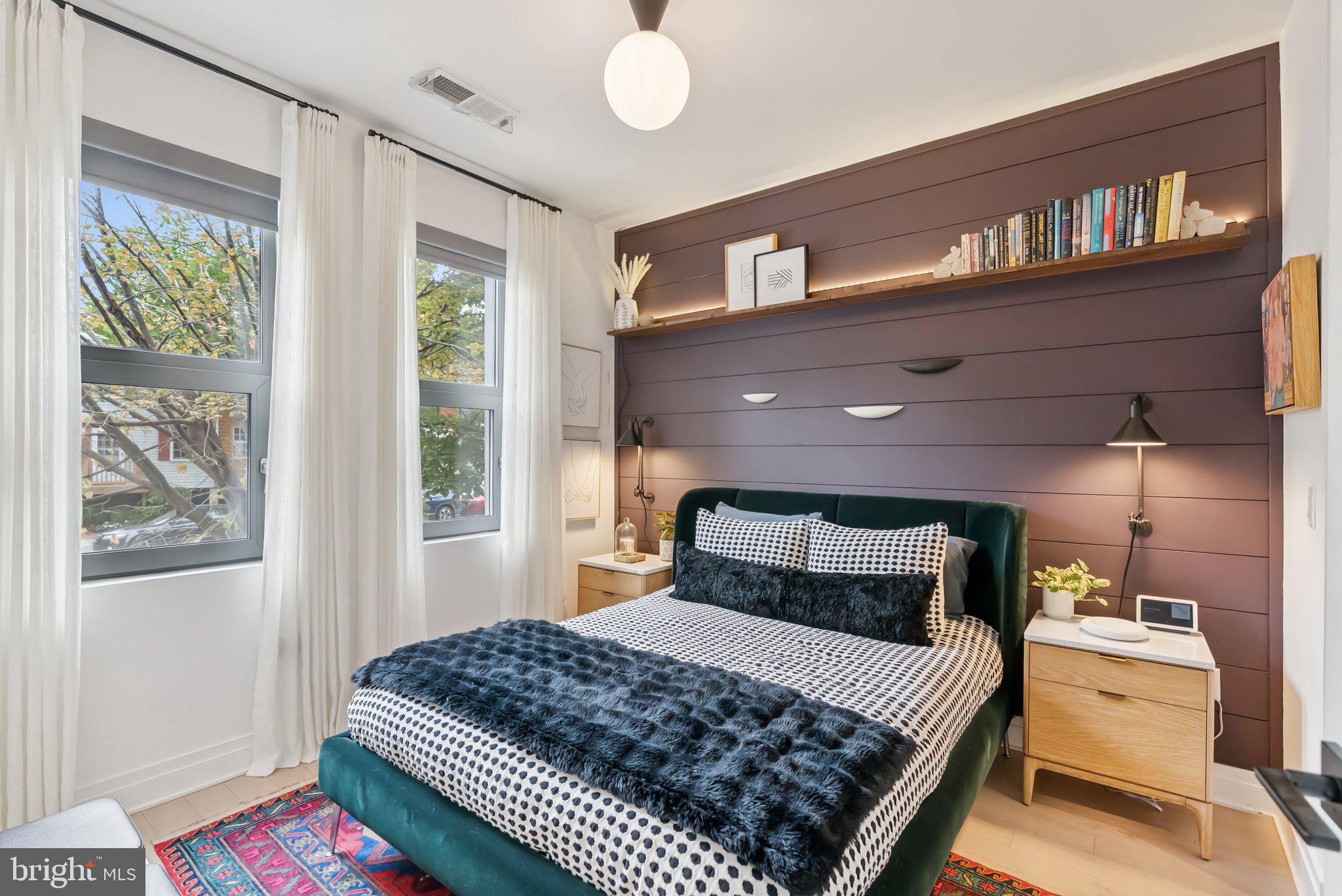 900 11th Street Southeast, Unit 106 Washington, DC 20003 - Photo 14 of 26 a bedroom with a bed and a window