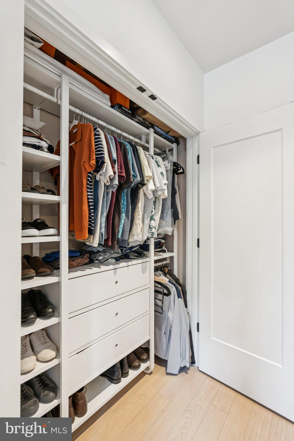 900 11th Street Southeast, Unit 106 Washington, DC 20003 - Photo 17 of 26 a view of walk in closet with clothes and shoes