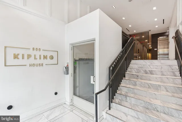 a view of entryway with lots of frames and shower