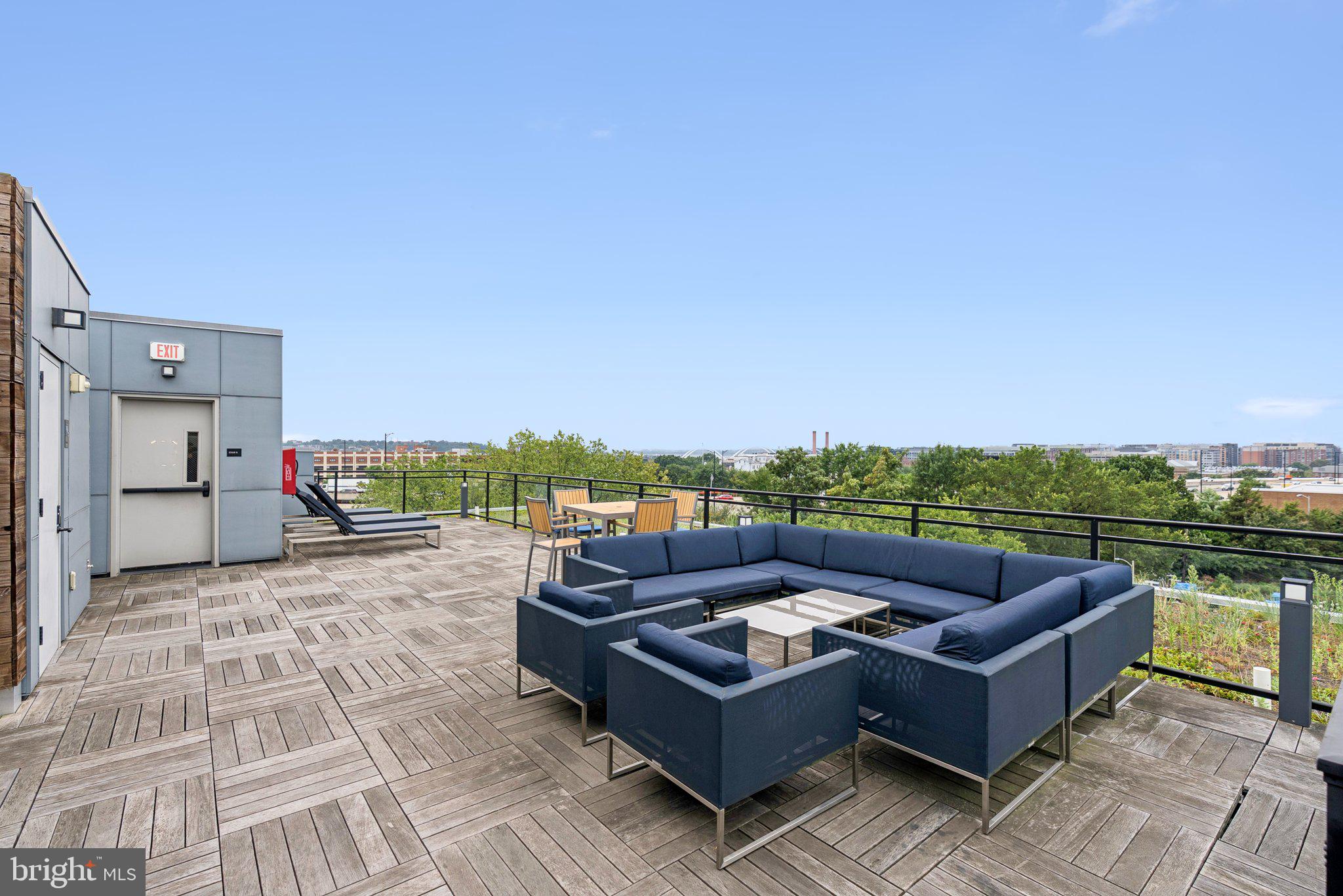 900 11th Street Southeast, Unit 106 Washington, DC 20003 - Photo 21 of 26 a view of a roof deck with couches and potted plants