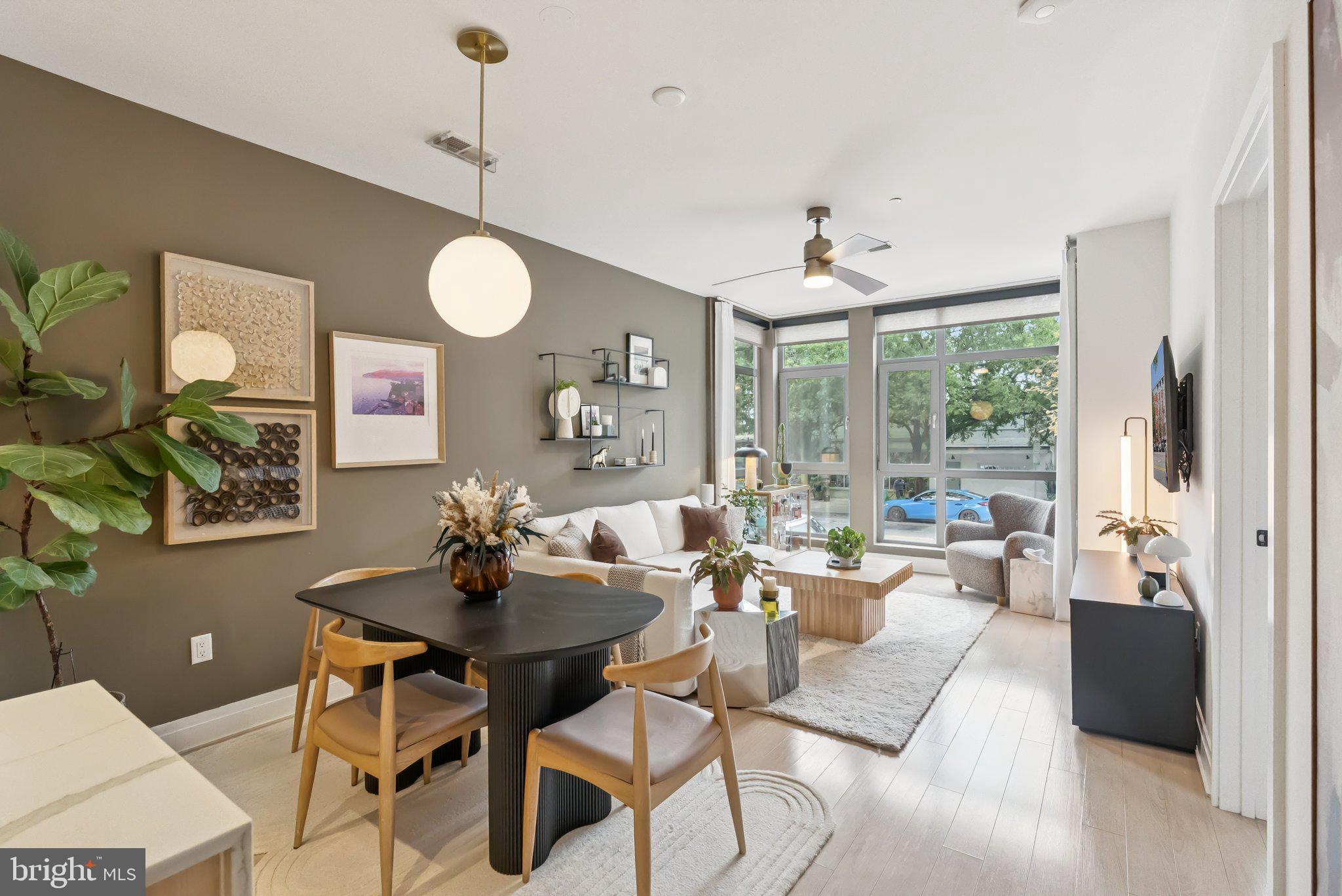 900 11th Street Southeast, Unit 106 Washington, DC 20003 - Photo 7 of 26 a living room with furniture and a large window