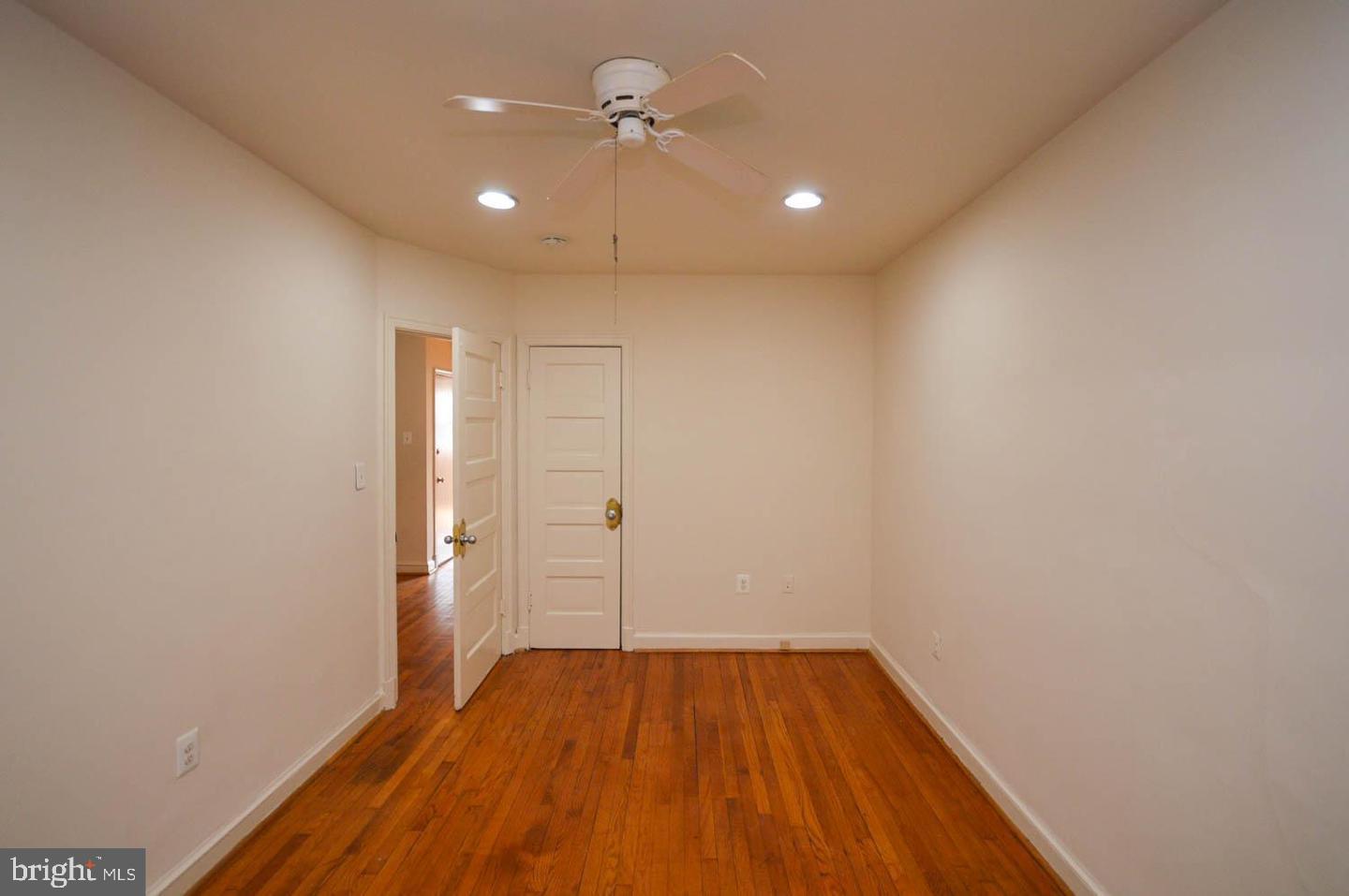 1722 T Street Southeast Washington, DC 20020 - Photo 13 of 23 a view of a room with wooden floor and ceiling fan